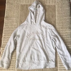Light grey hoody that says “this girl’s fabulous”